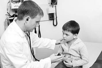 Physician checking patient's belly.