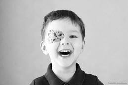 young boy with a patch on his eye