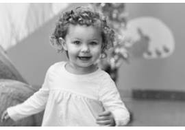 Toddler Girl Running Toward Camera Smiling