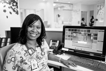 Nurse sitting in front of her computer
