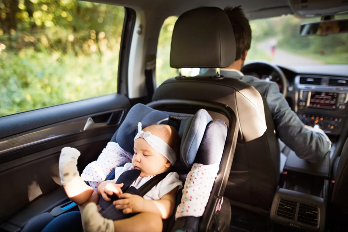 infant child sitting in car seat