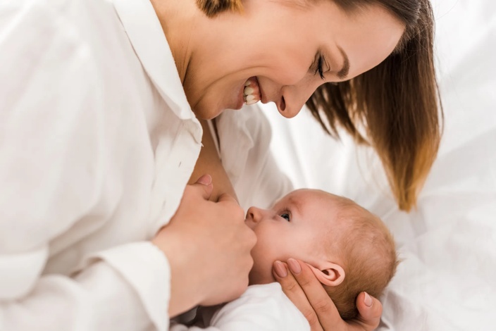 mother breastfeeding infant