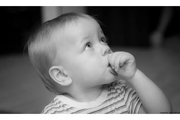 baby sucking their thumb