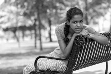 girl sitting on bench