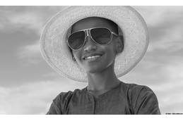 Kid wearing hat and sunglasses