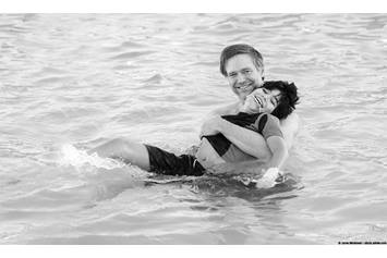 Child and instructor in aquatic therapy