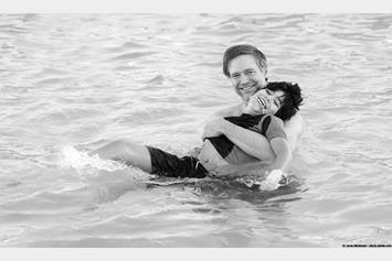 Child and instructor in aquatic therapy