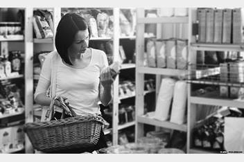 Women reading labels on products while shopping