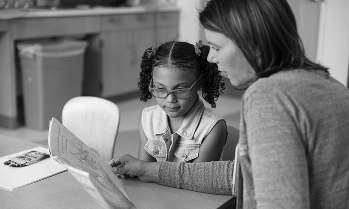 Child with dyslexia learning how to read.