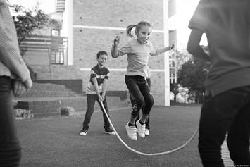 Kids jumping rope of the playground