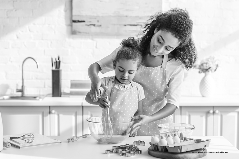 Mother and daughter baking in the kitchen