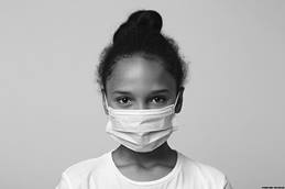 Little girl wearing face mask