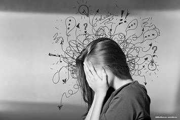 Child with hands over face