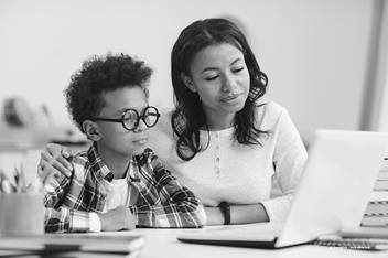 Mother and son looking at laptop computer