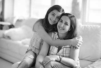 mom and daughter hugging