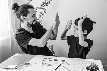 adult and child high-fiving.