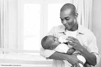 blog baby registry man holding a child