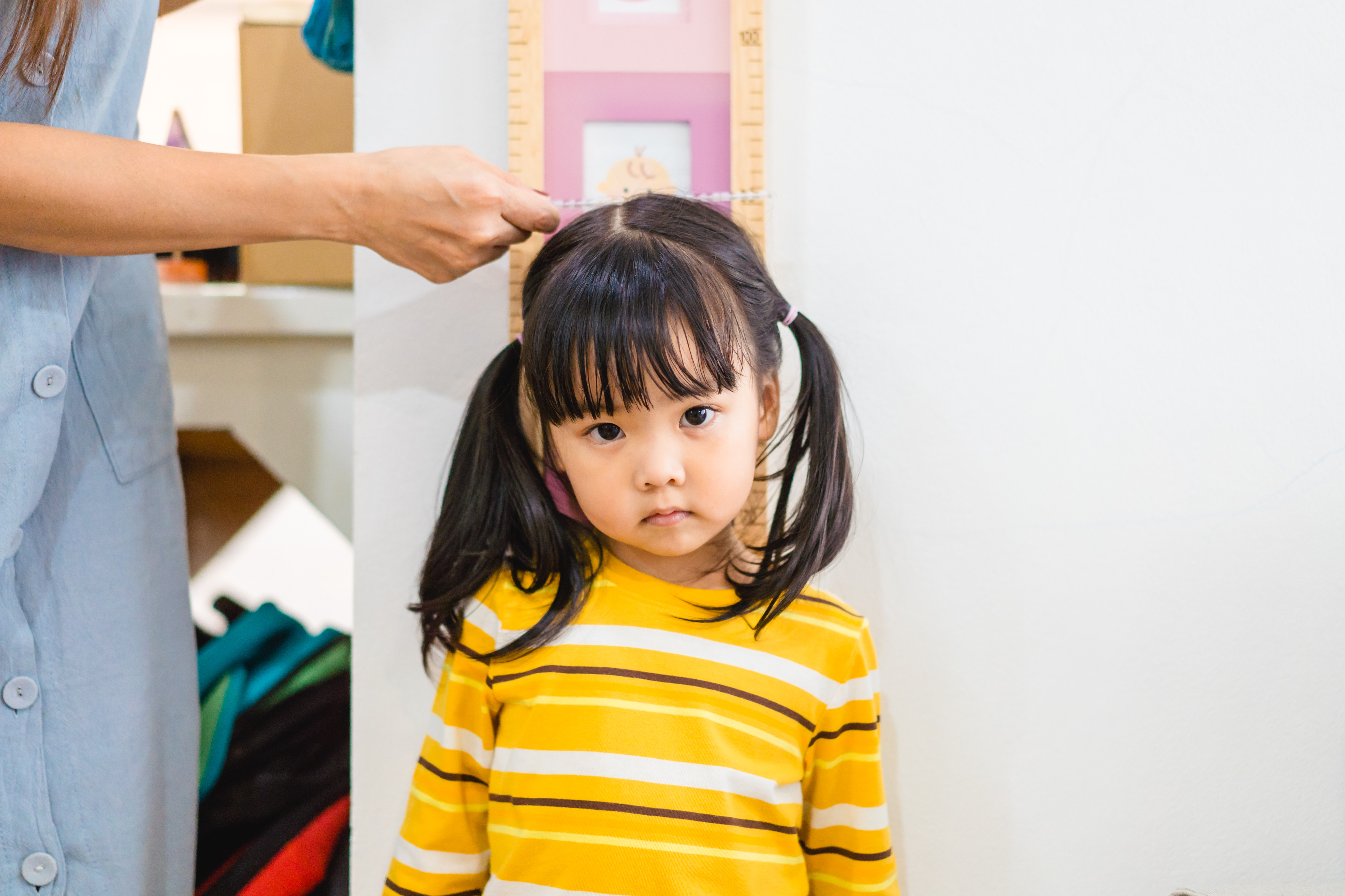 child getting height measured
