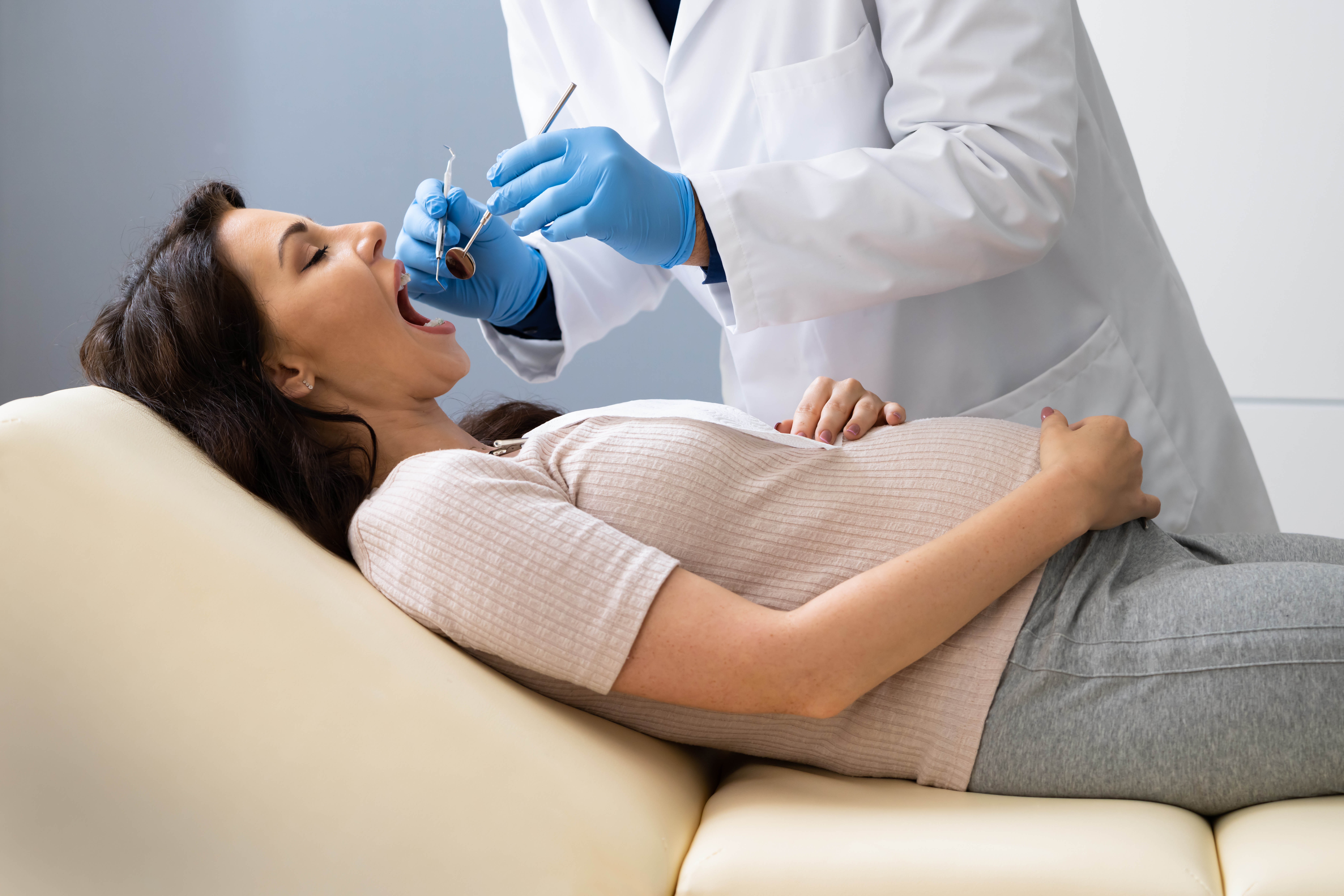 pregnant woman getting dentist check-up