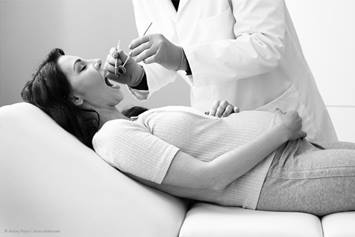 pregnant woman getting dentist check-up