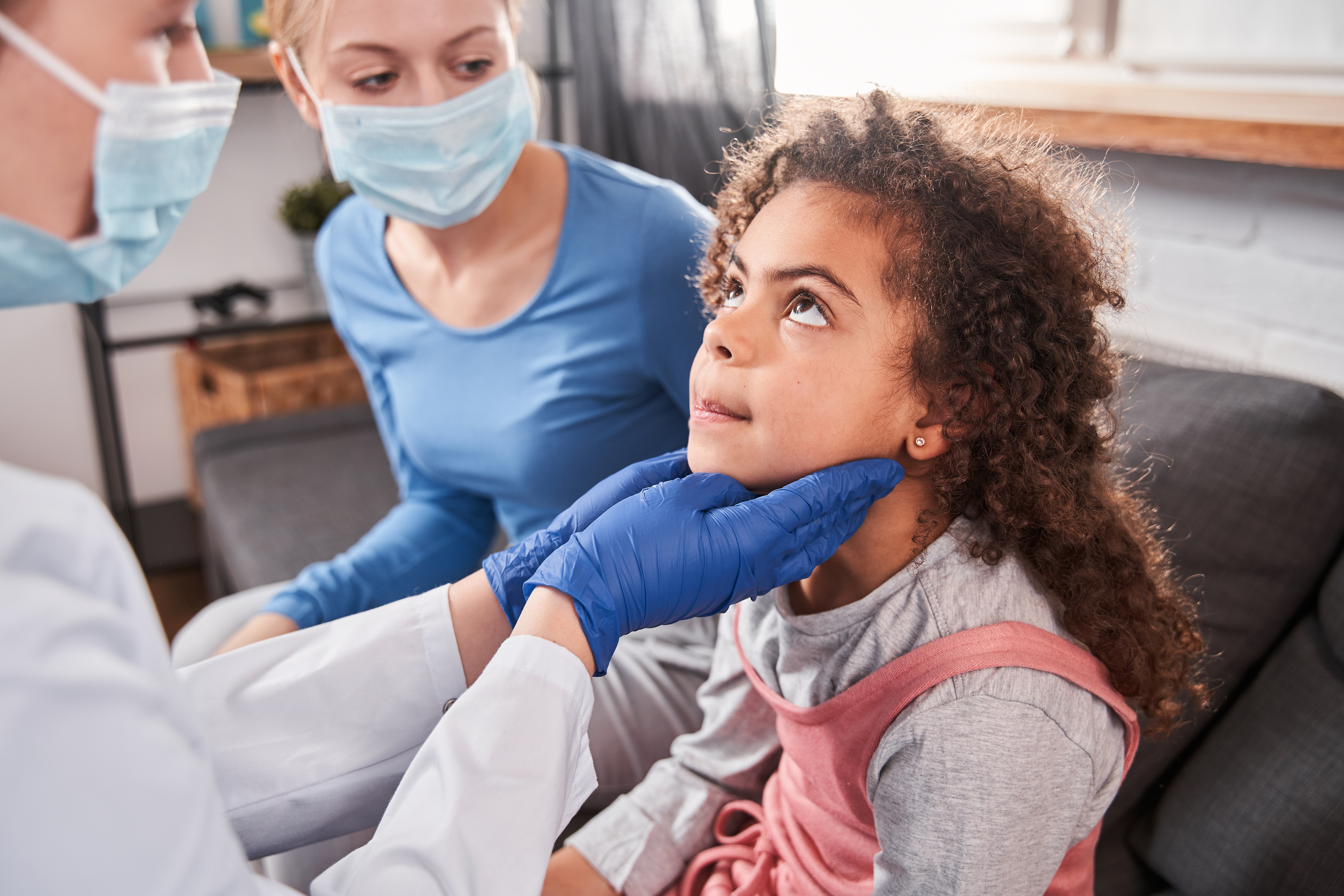 doctor checking a patient's lymph nodes