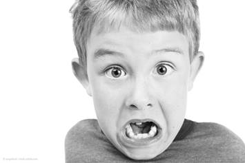 Young boy with mouth open