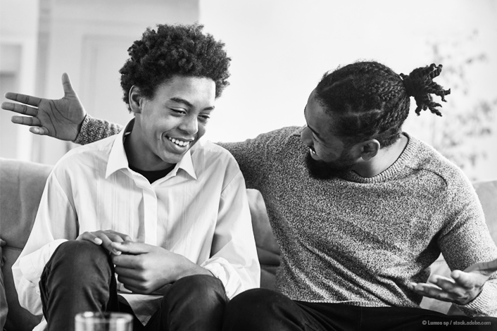 father talking to his son