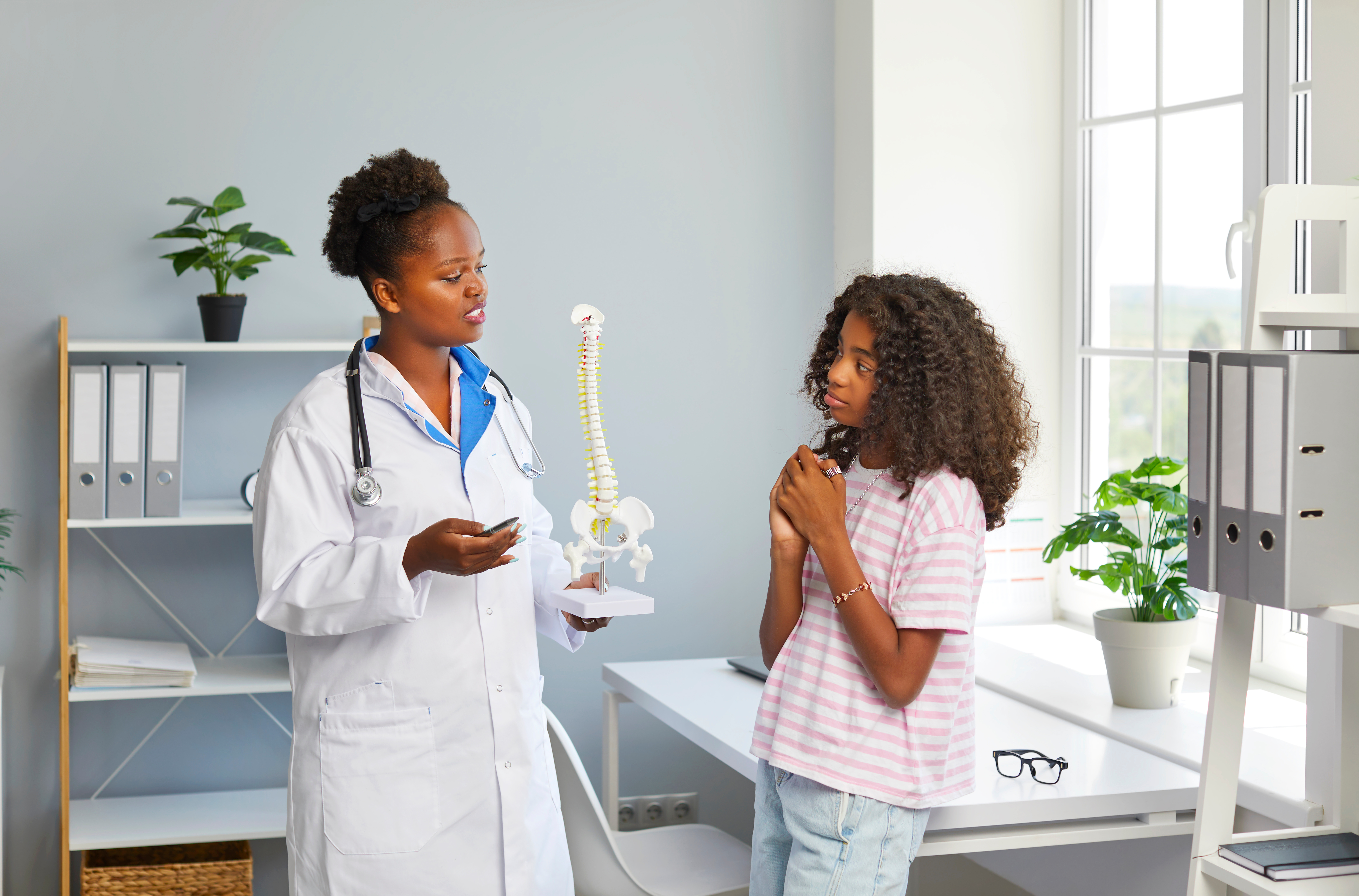 Doctor talking to young girl