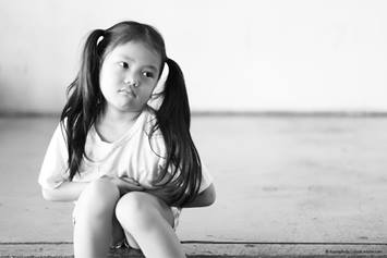 young girl looking sad