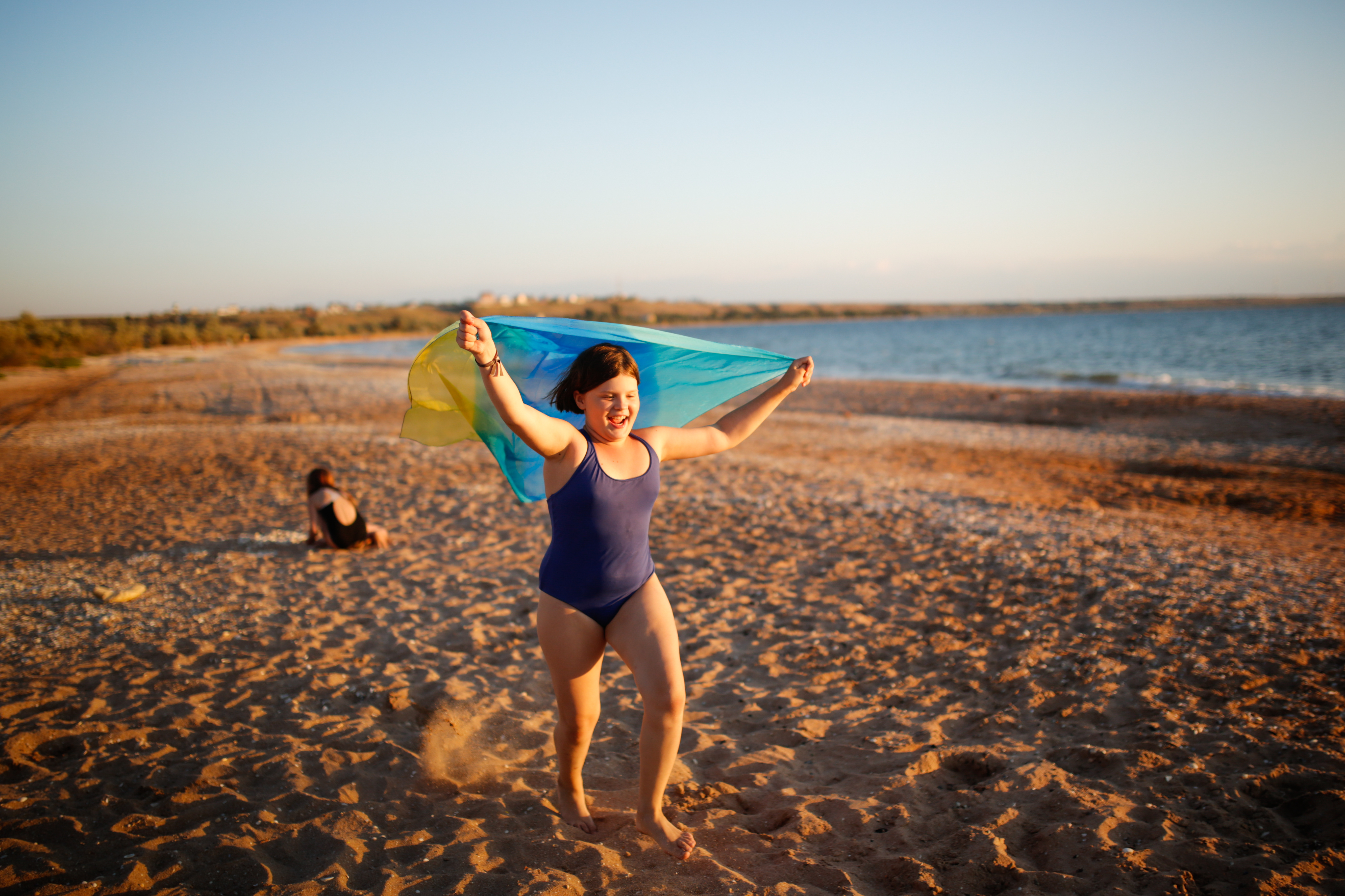 Young girl running on the beach