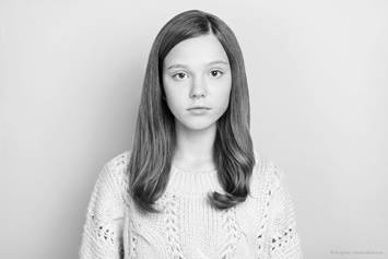 girl against white wall