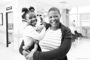 mother holding her child on her hip