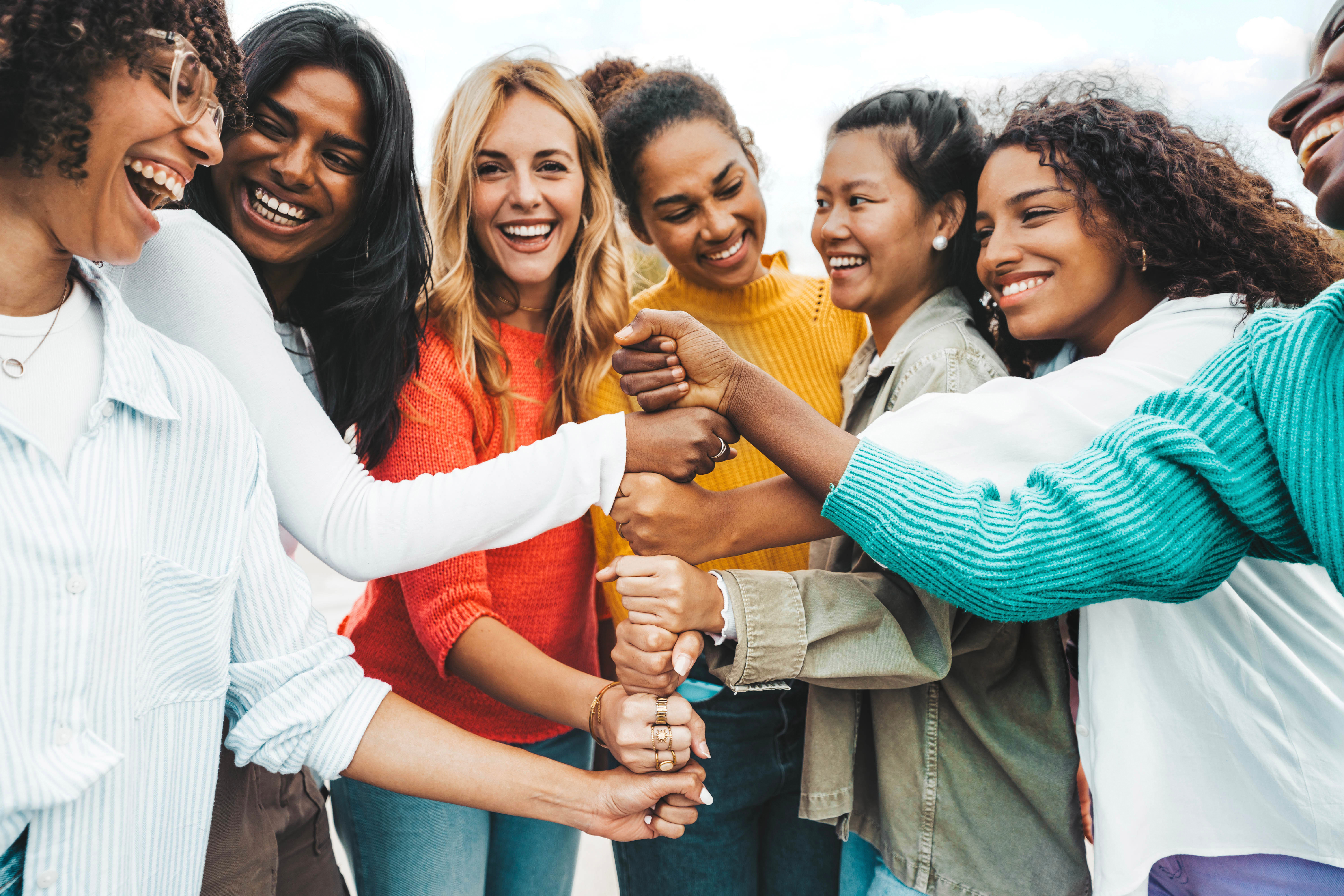 group of teens smiling together