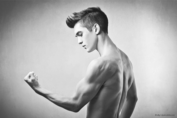 young man flexing his arm