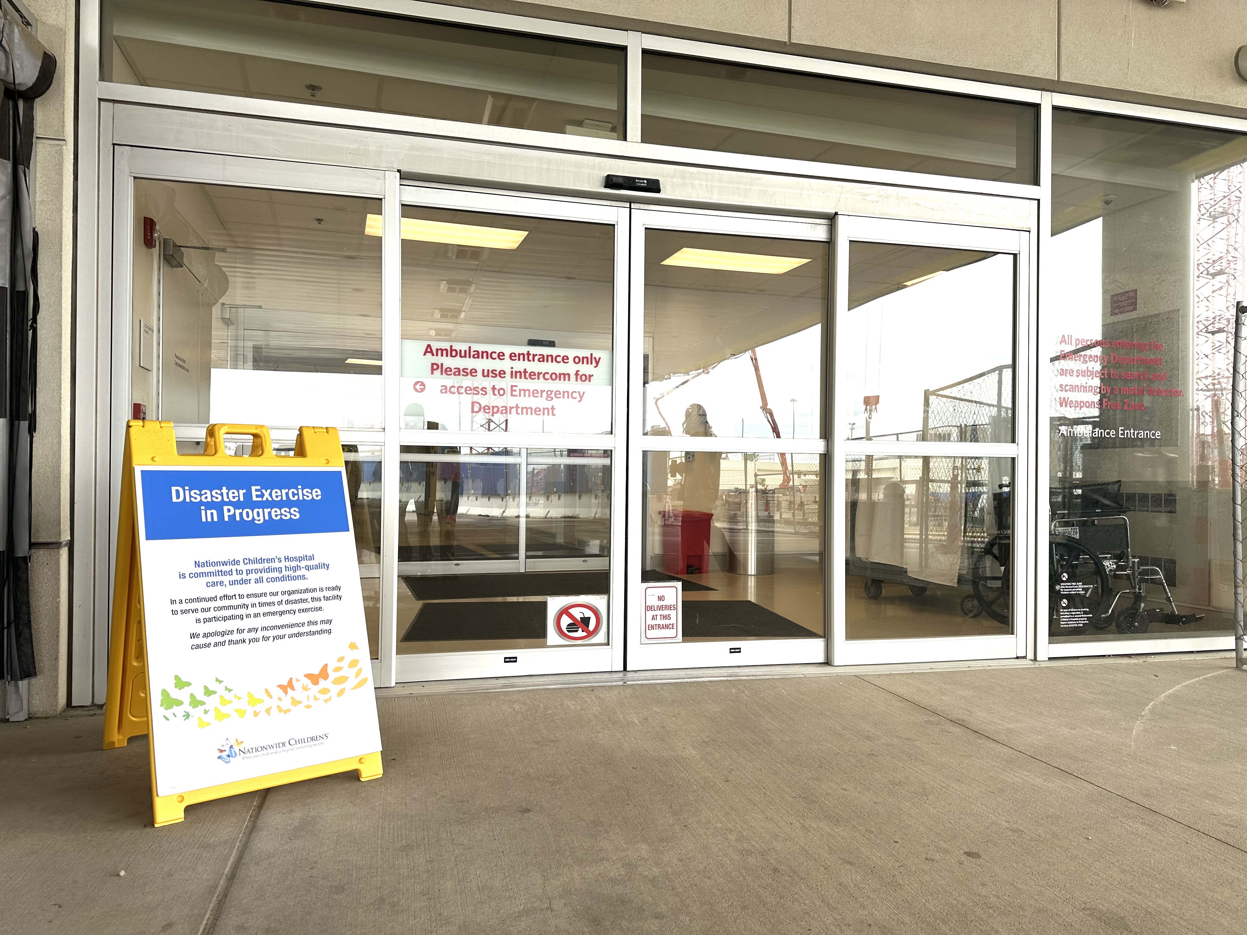 Emergency drill sign in front of a door