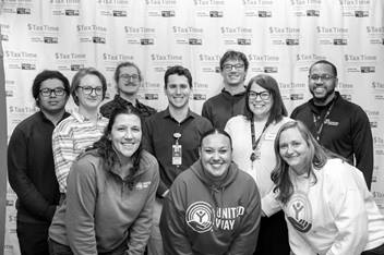 A group of smiling volunteers at the United Way and Nationwide Children's 2025 Super Saturday event