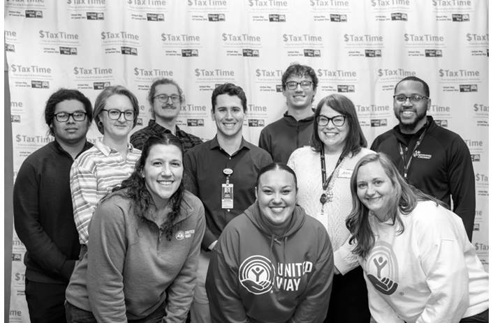 A group of smiling volunteers at the United Way and Nationwide Children's 2025 Super Saturday event