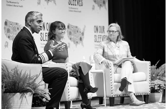 US Surgeon General speaks on stage with Ariana Hoet and Ann Fisher