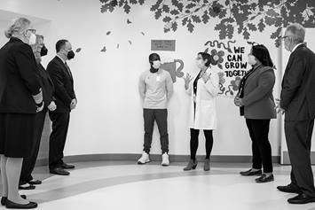 A group of individuals meet at the Big Lots Behavioral Health Pavilion at Nationwide Children's Hospital