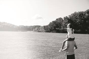 Sister on brother's shoulders
