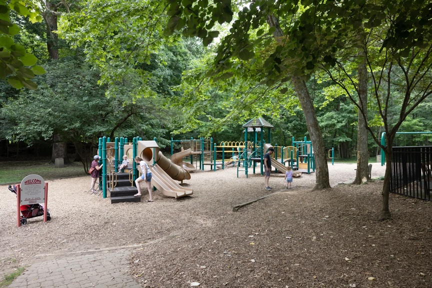 outdoor playground surrounded by trees