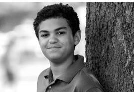 Pre Teen Boy Leaning on a Tree