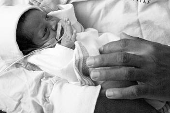 Doctor Holding Infant