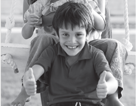 Child giving two thumbs up gestures. 