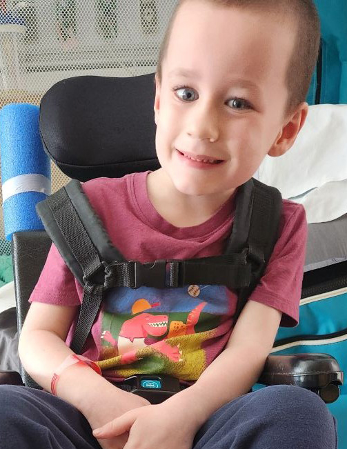 Evan in a wheelchair