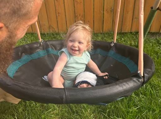 young girl on swing