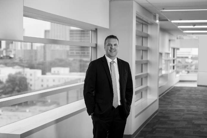 Dr. Dane Snyder stands in a hallway at the Livingston Ambulatory Center
