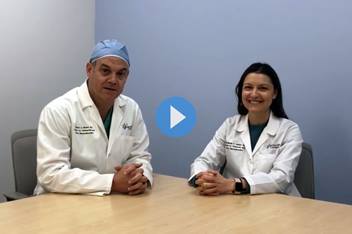 Dr. Wood and Dr. Gasior smile for a photo before beginning a conversation on the colorectal transitional care program.