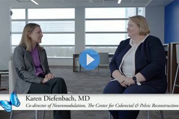 Two physicians discussing sacral nerve stimulation therapy