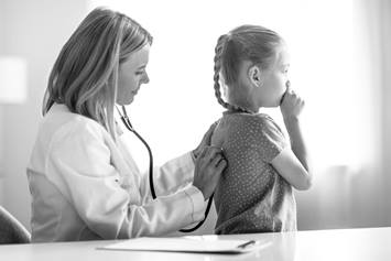 Doctor listening to a patient's lungs